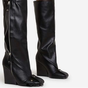 Black Faux Leather Knee boots with Zipper, Buckle Toe Detailing and Wedge heel.